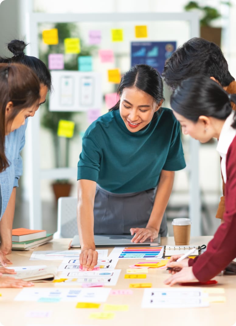 close-up of coworkers going over information during meeting