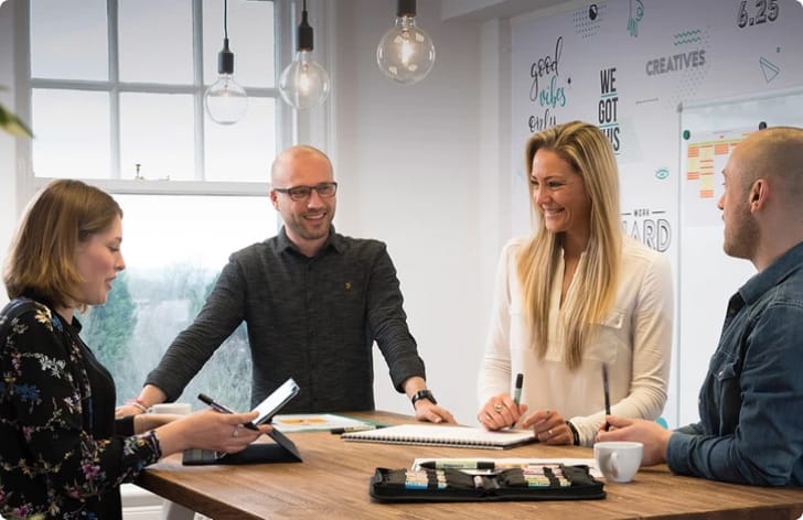 group of coworkers having a meeting