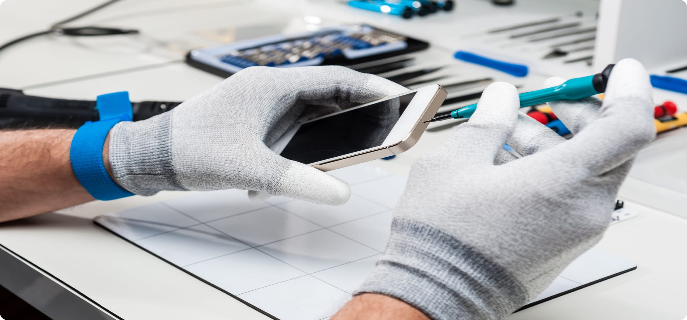 gentleman repairing cell phone