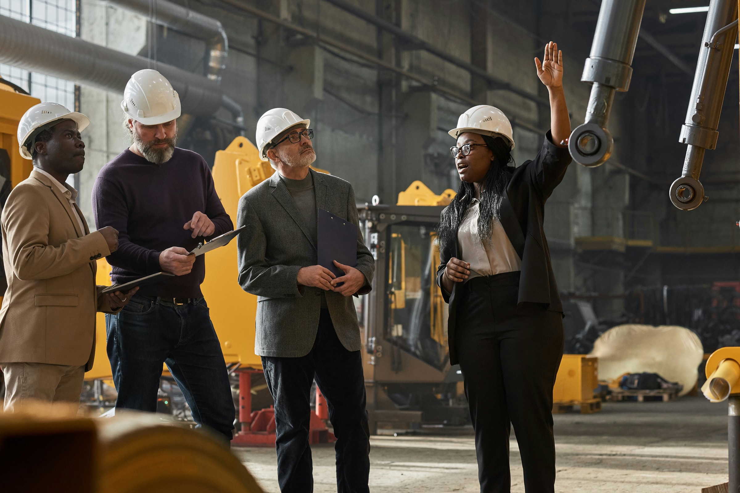 three inspectors inspecting machinery